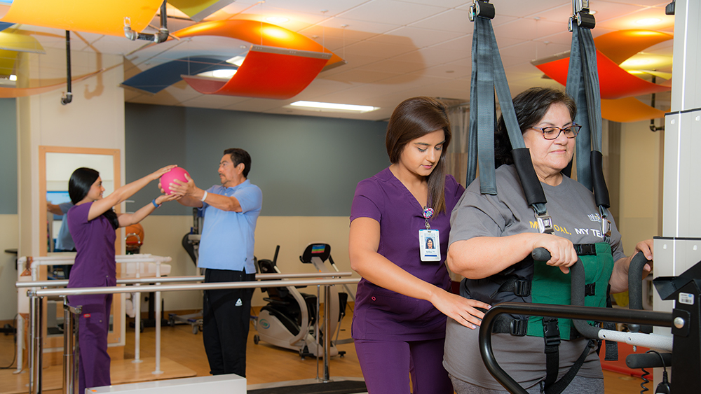 TIRR therapists with rehabilitation patients at Greater Heights Inpatient location