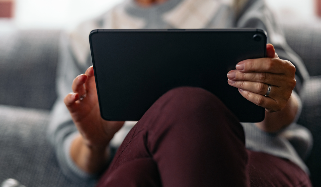 Person scrolling through iPad