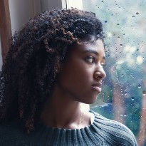 Woman looking out of window