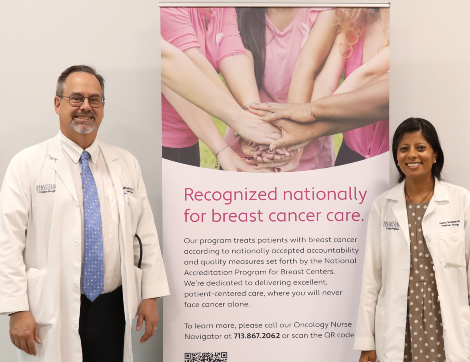 Physicians at Greater Heights Cancer Center pose with new banner.