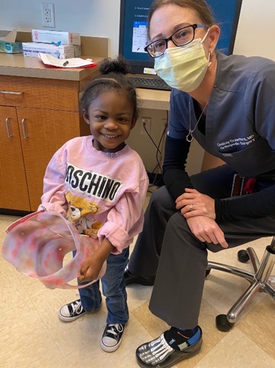 Khai'Mora with her cast and doctor
