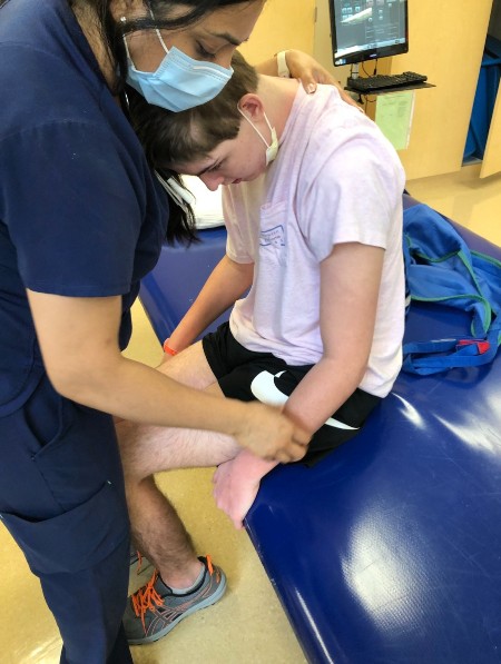 TIRR Memorial Hermann patient, Davis Coker, works with a physical therapist.