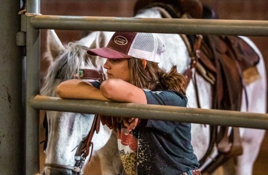 Former patient of TIRR Memorial Hermann, Dawson Oliver, with the horses before her diagnosis.