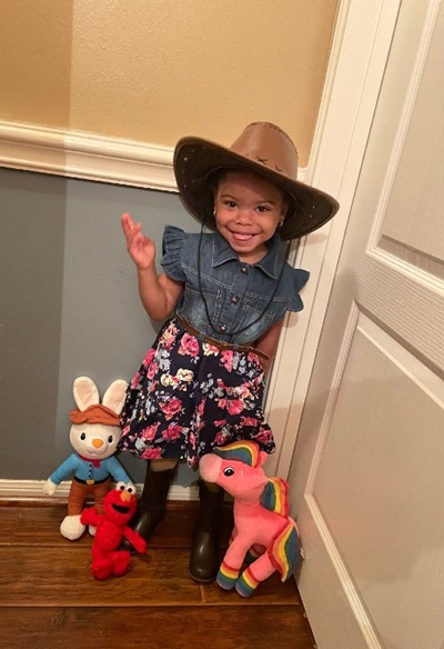Sutton with her toys