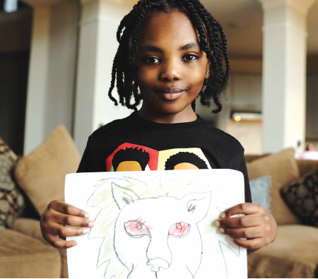 TIRR Memorial Hermann former patient, Zion Walker, displays his artwork.