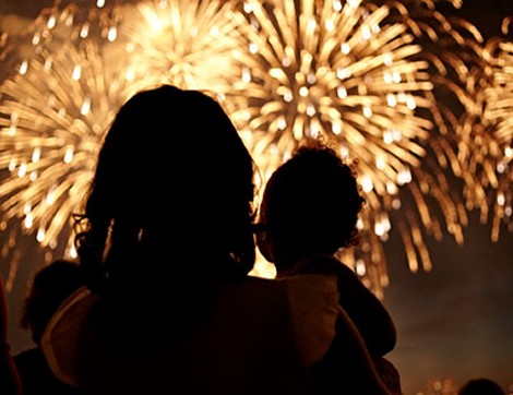 parent and child watching fireworks