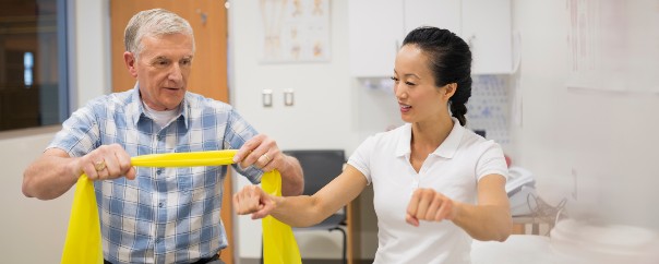 Older man doing physical therapy