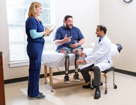 TIRR Memorial Hermann patient, Alex, discusses osseointegration with his physician and physical therapist.