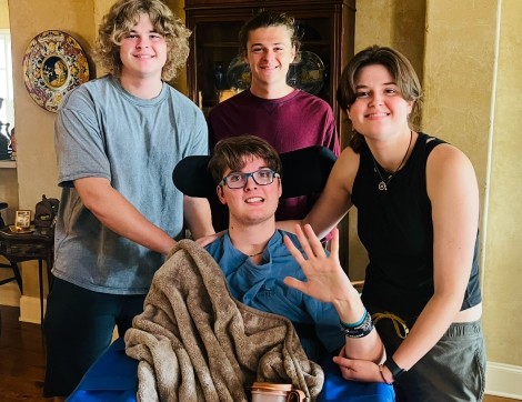 TIRR Memorial Hermann Neurobehavioral Program patient, Davis Coker, smiles with his three siblings.