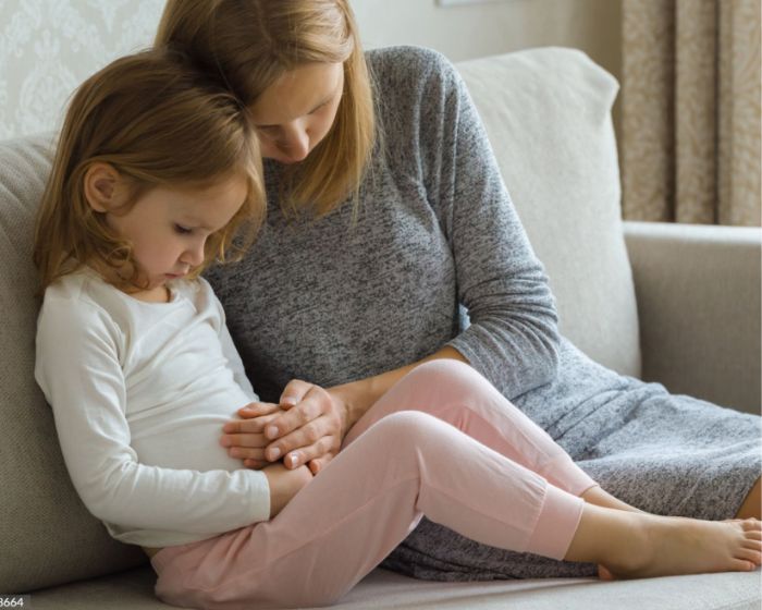 mom holding child's stomach