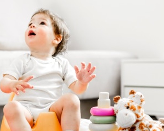 child sitting with toys
