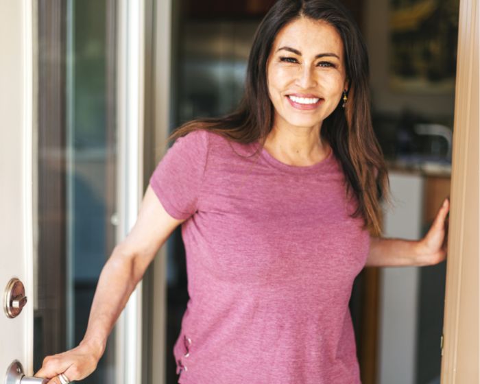 woman smiling in doorway