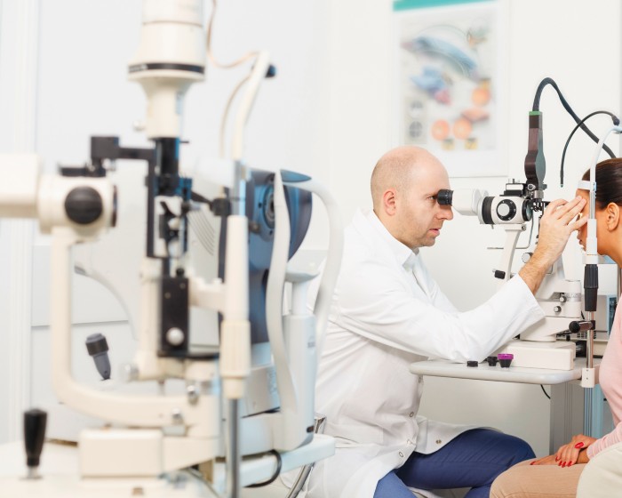 Doctor checking patient's eyes