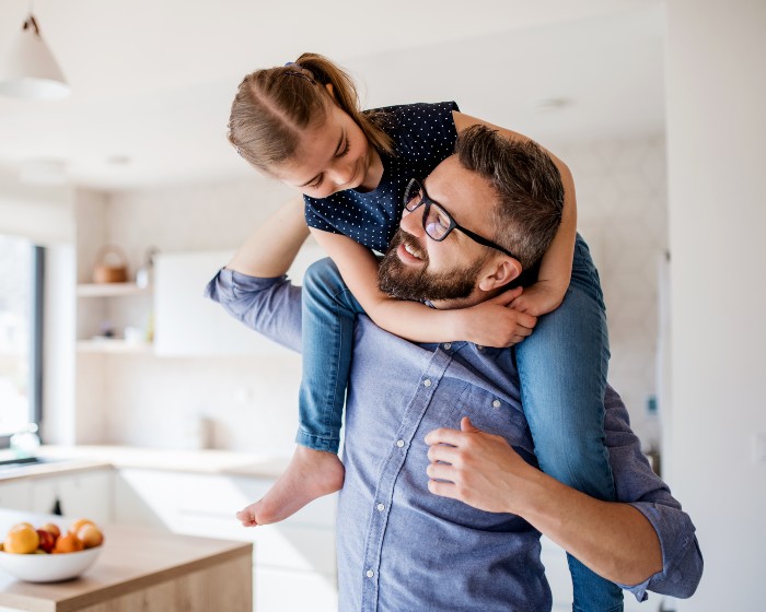 Dad with daughter on his shoulders